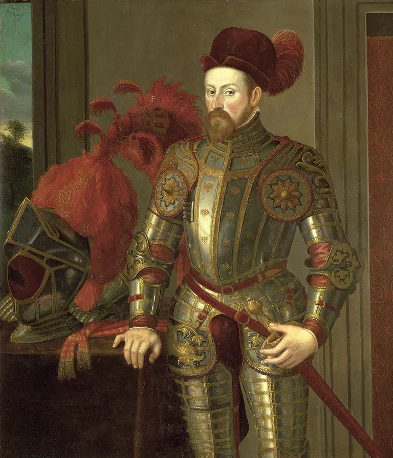 A nobleman in ornate armor stands confidently, holding a sword. He has a prominent beard and wears a red feathered hat. Behind him, a decorative helmet rests on a table, accentuated by a red plume. The background features a landscape and a patterned wall.
